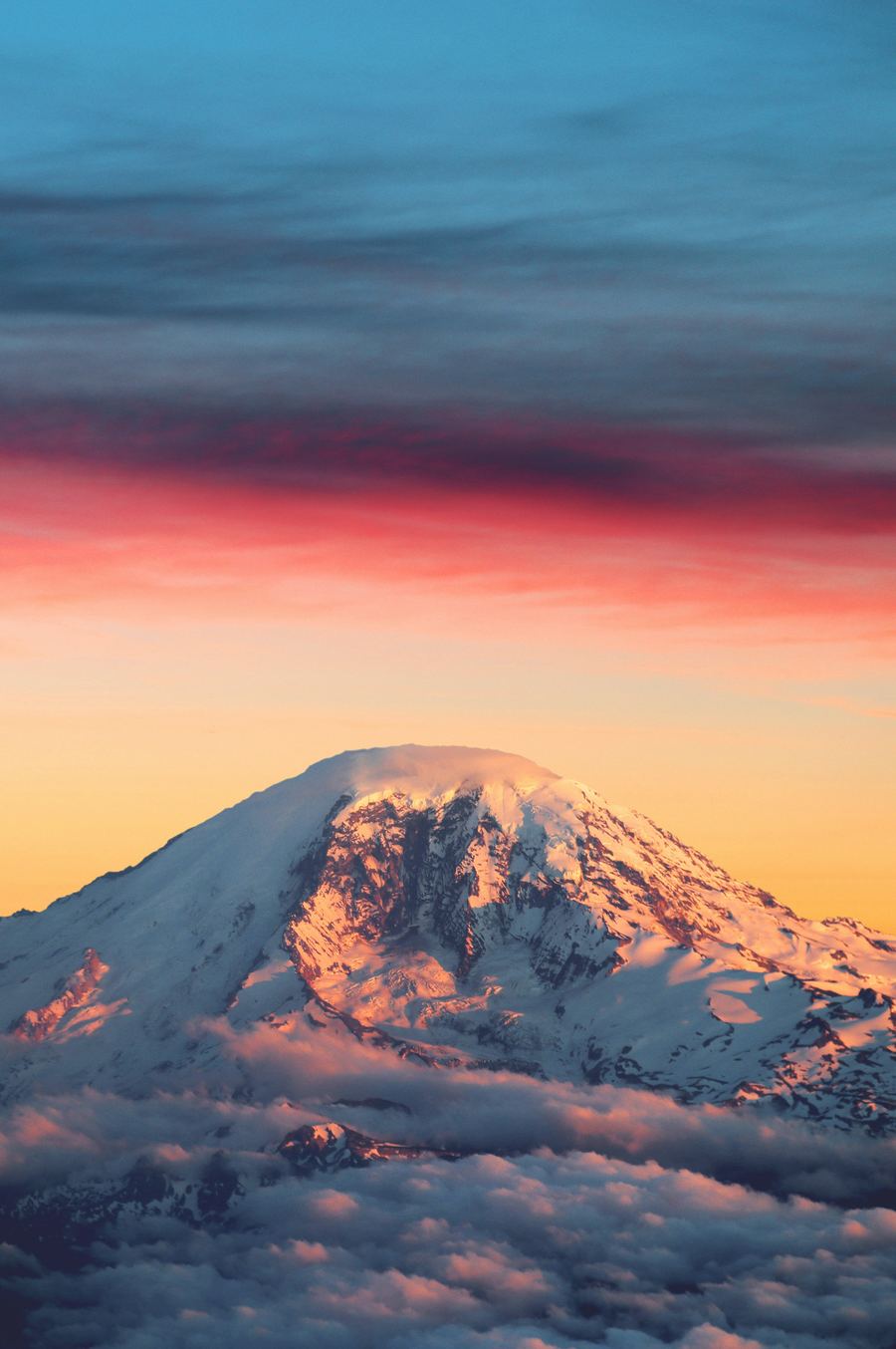 Mount Rainier above the clouds at sunset