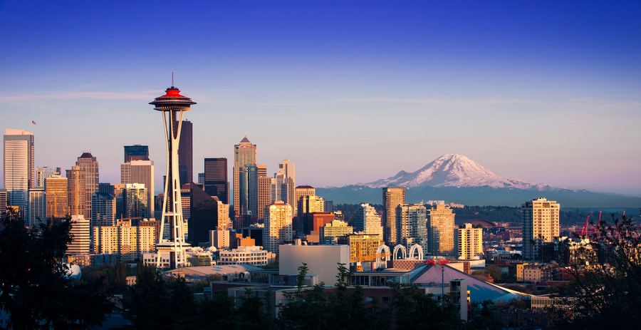 Seattle skyline with the Space Needle and Mount Rainier at sunset