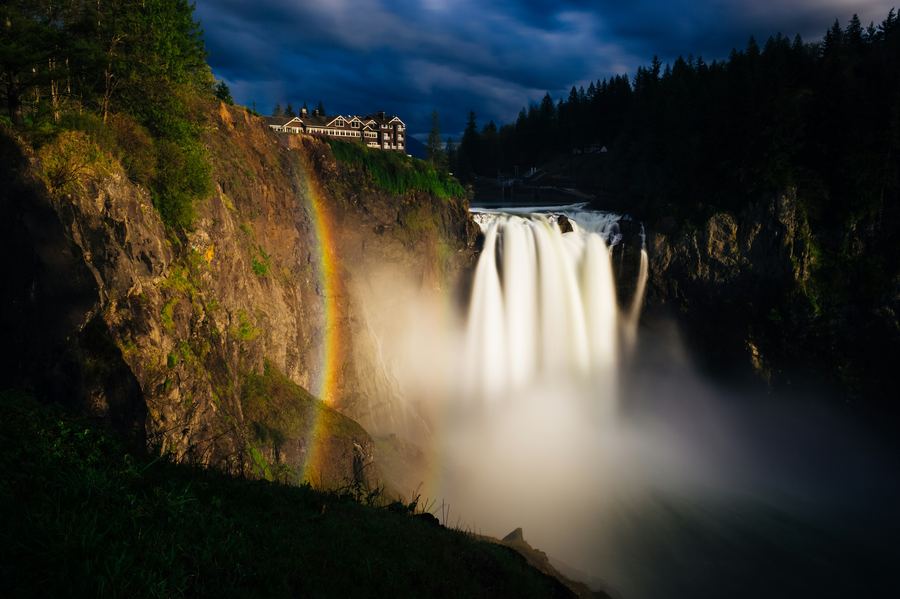 Twin Falls waterfall with a rainbow at dusk